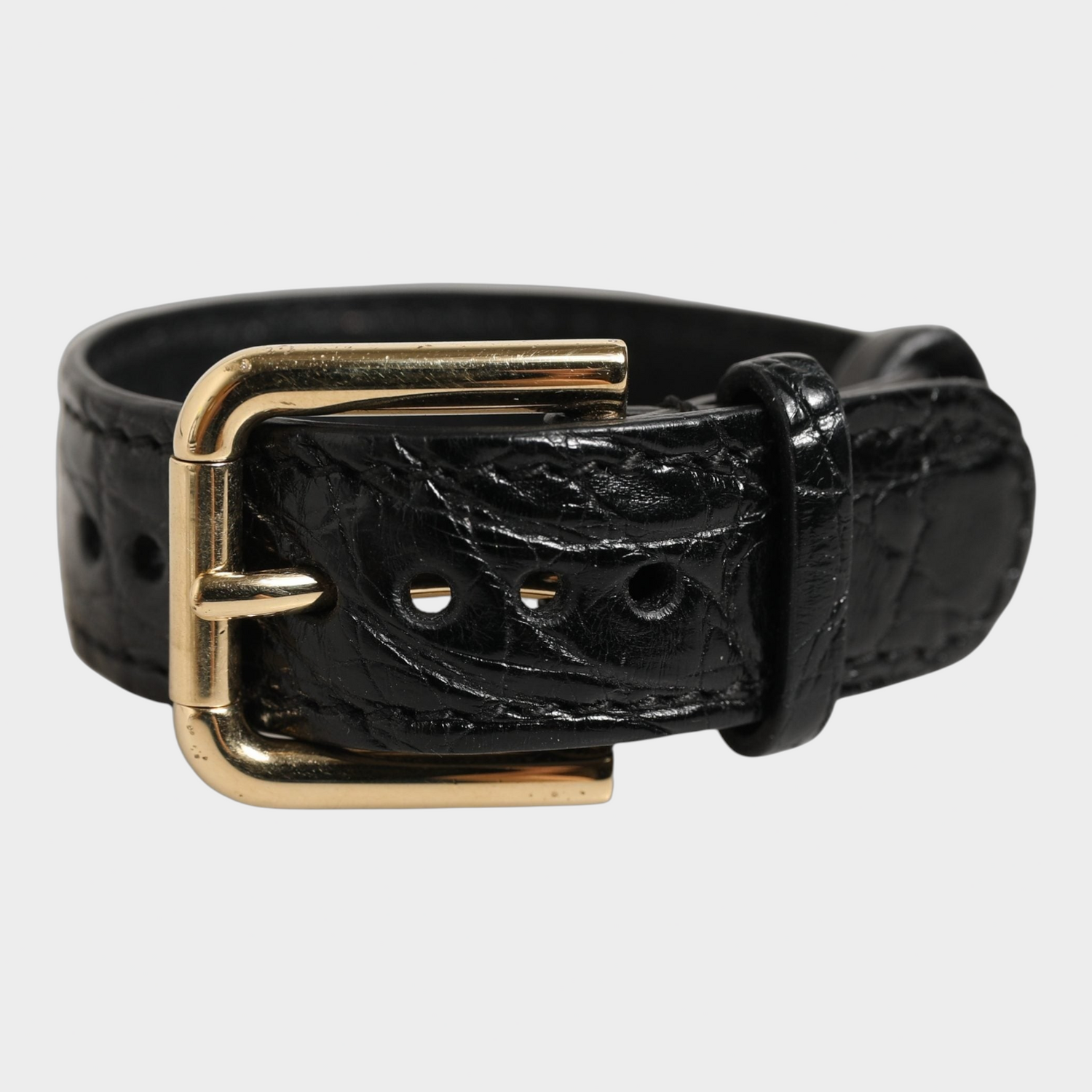 Esmire & Co Dolce & Gabbana black caiman leather bracelet belt with a polished gold-tone buckle closure.