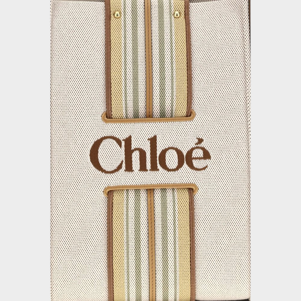 Esmire & Co Chloé beige cotton canvas Woody tote bag with striped vertical leather trim and embroidered logo detail.