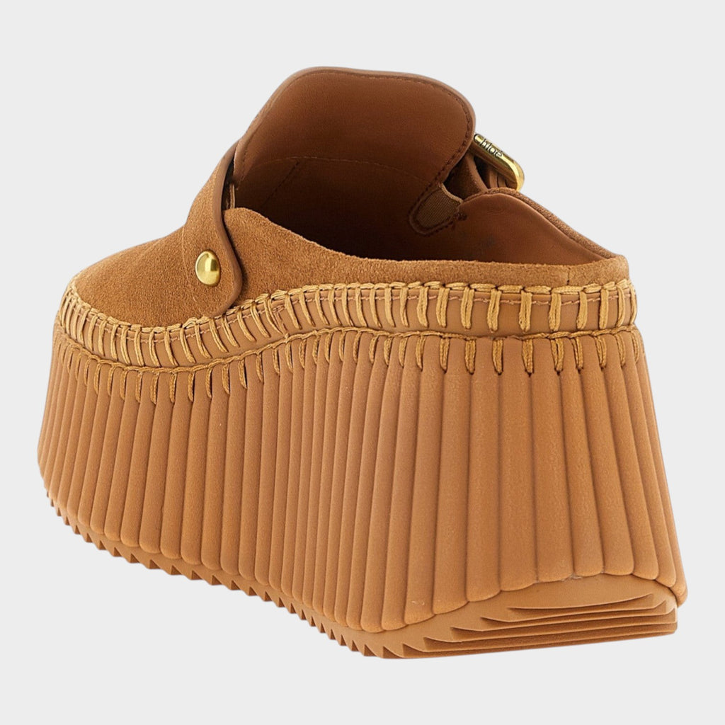 Esmire & Co beige calfskin suede wedge sandals with a textured platform sole and contrast stitching detail.