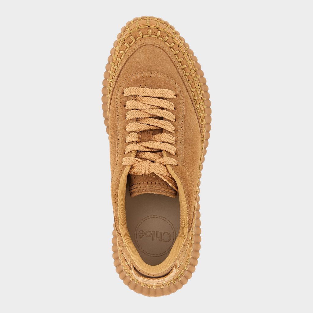Esmire & Co beige Chloé Nama platform sneakers with suede upper, handmade stitching, and grooved rubber sole.