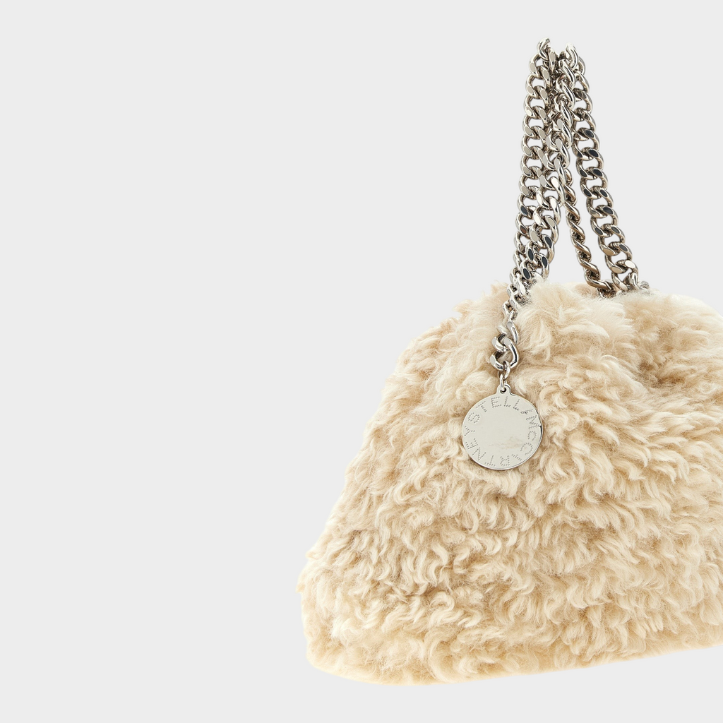 Esmire & Co Stella McCartney beige faux shearling Falabella mini handbag with silver chain handles and logo pendant