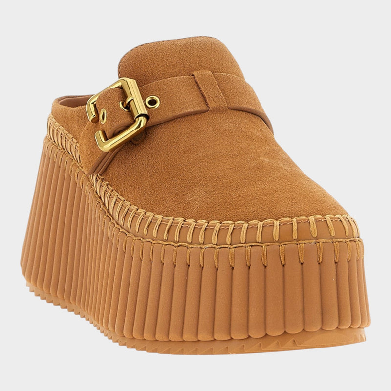 Esmire & Co beige suede wedge sandals with a gold metal buckle and contrast stitching on a textured platform sole.