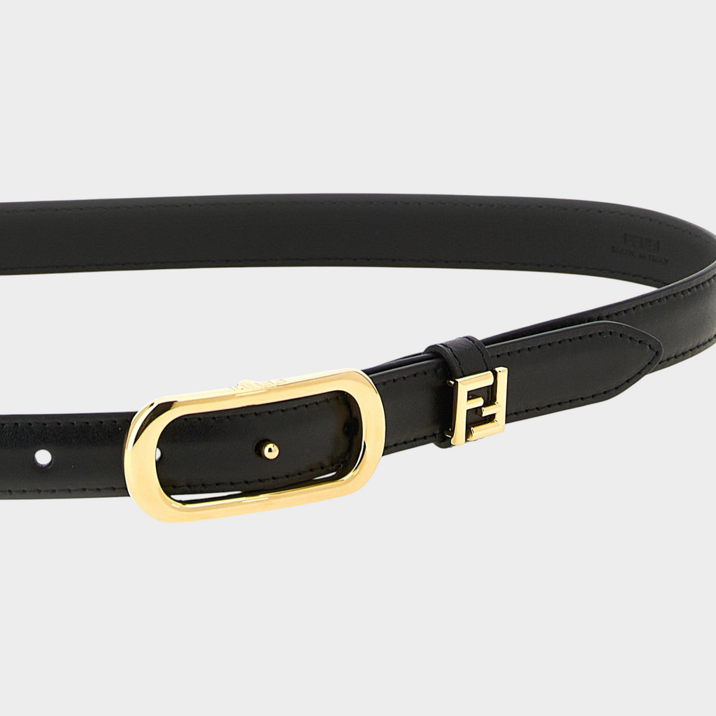 Esmire & Co black calfskin thin belt featuring a gold oval buckle and a small metal FF logo detail.