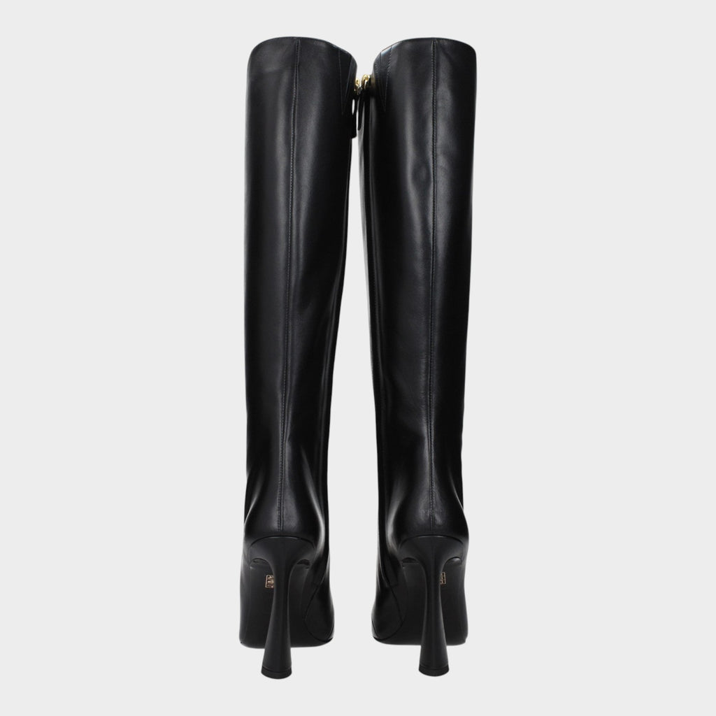 Esmire & Co black leather high heel boots featuring a sleek tall silhouette and elegant flared heels, back view.
