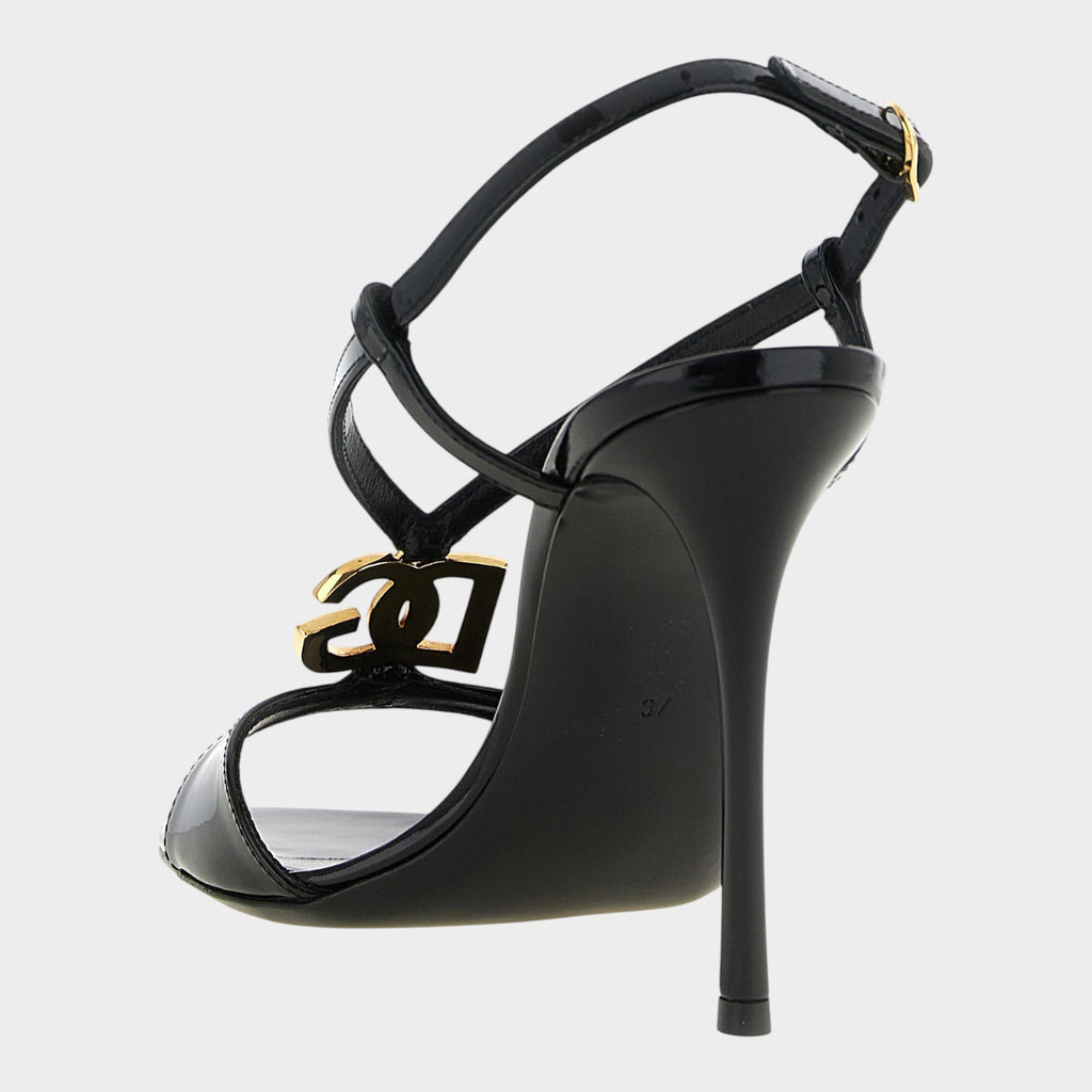 Esmire & Co black patent calfskin stiletto sandals with gold DG logo and adjustable ankle strap