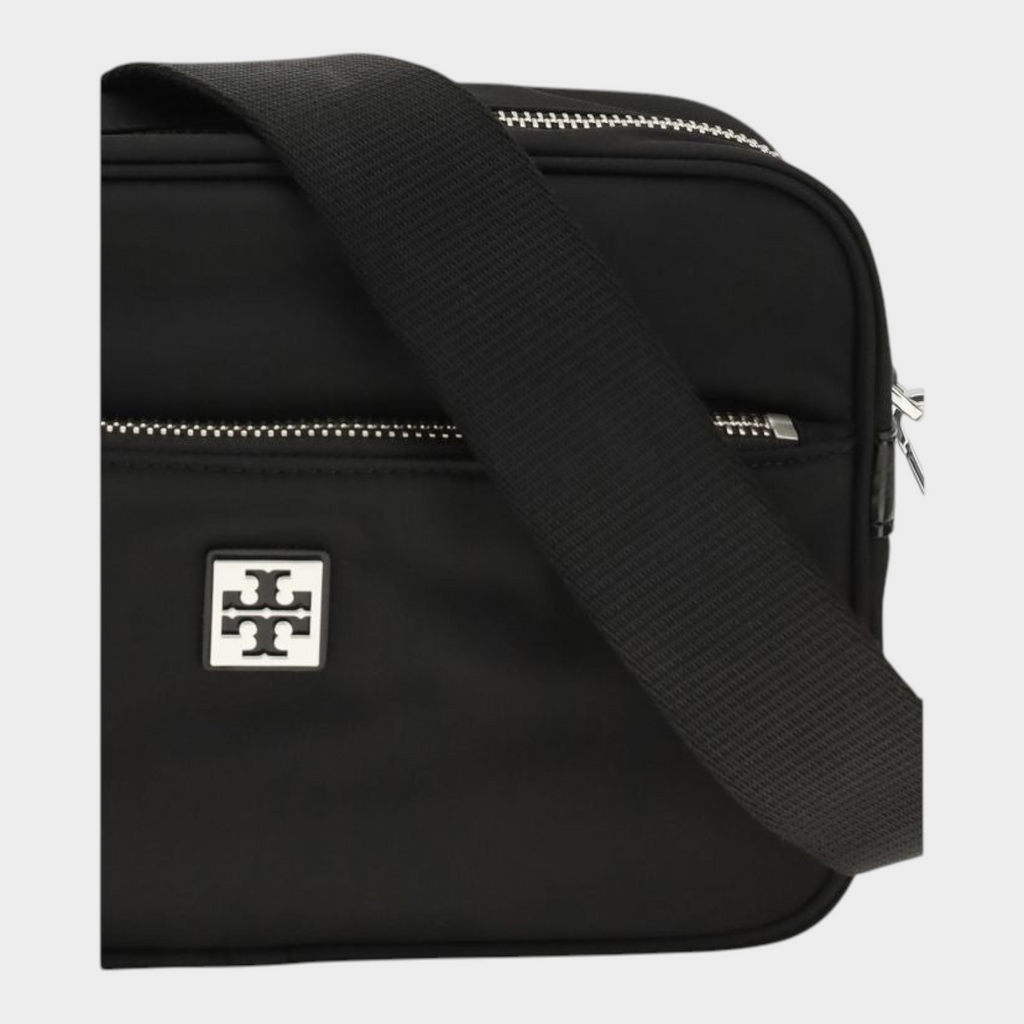 Esmire & Co Tory Burch black polyamide shoulder bag with silver logo plaque, webbing strap, and front zip pocket