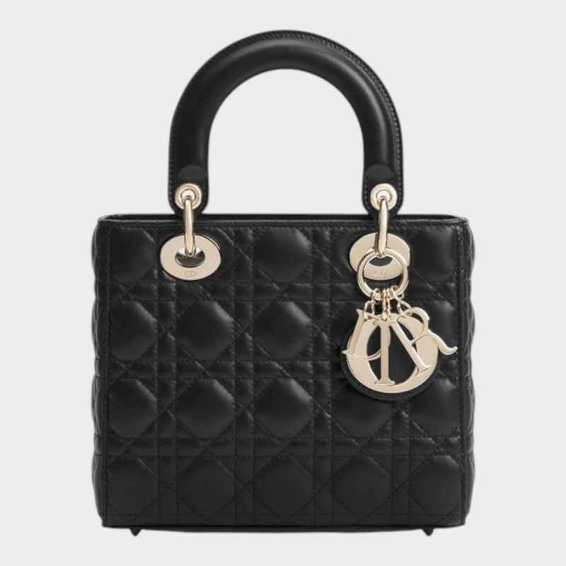 Esmire & Co black quilted lamb leather Dior handbag with pale gold D.I.O.R. charms and top handles.