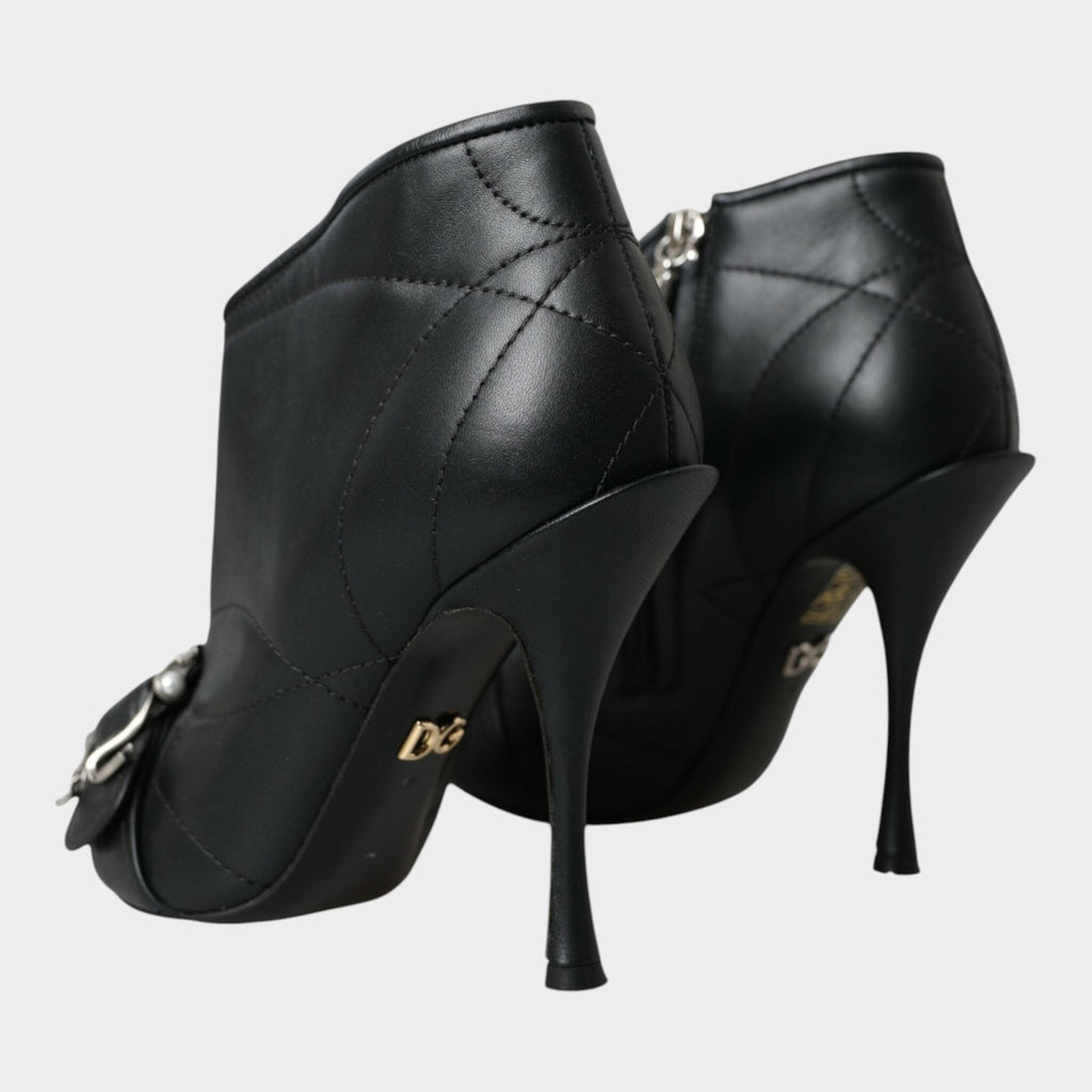 Esmire & Co black quilted leather stiletto booties with buckled detail and DG logo on the heel