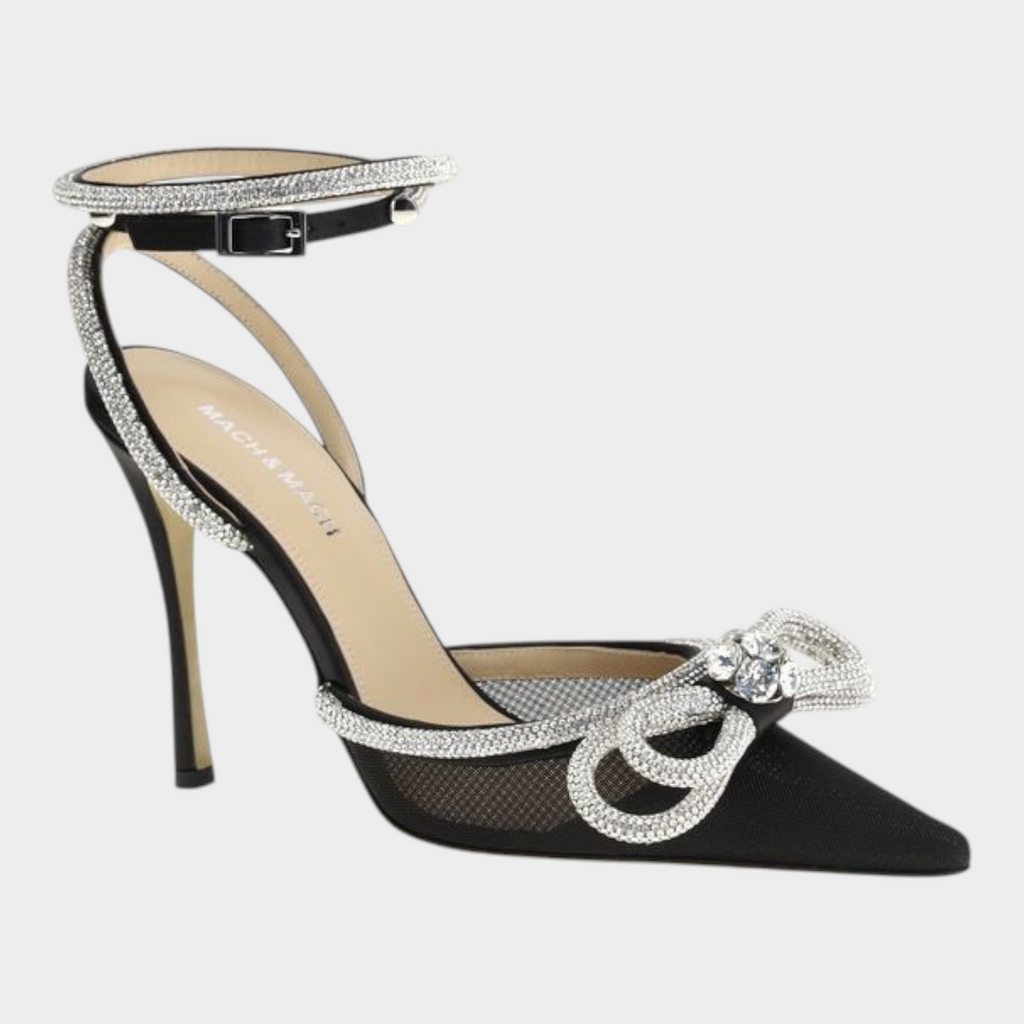 Esmire & Co black silk satin pumps featuring crystal-studded double bows, ankle straps, and a high stiletto heel.