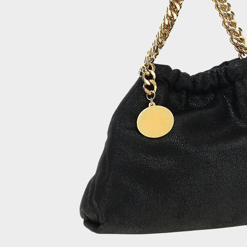 Esmire & Co black Stella McCartney Falabella crossbody bag in vegan Shaggy Deer fabric with gold chain strap