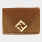 Esmire & Co brown calfskin leather trifold wallet with a gold FF logo and envelope flap design.