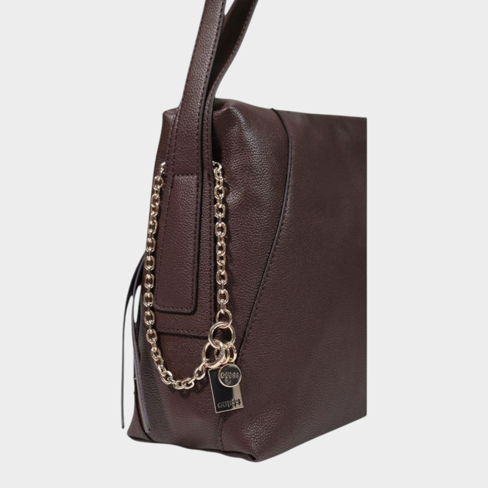 Esmire & Co brown Guess Lucci girlfriend satchel handbag with a textured finish and decorative side chain detail.