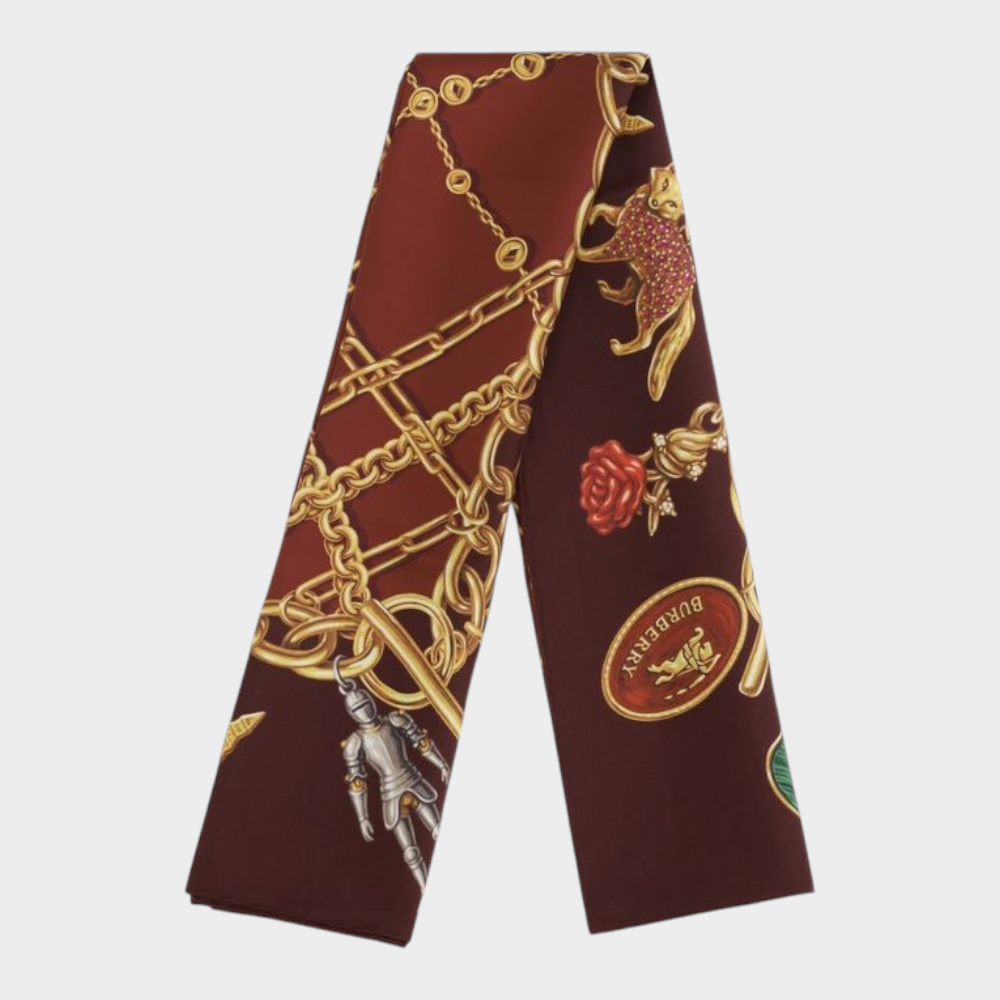Esmire & Co Burberry bordeaux silk scarf featuring a gold charm jewellery print on a rich deep red background.