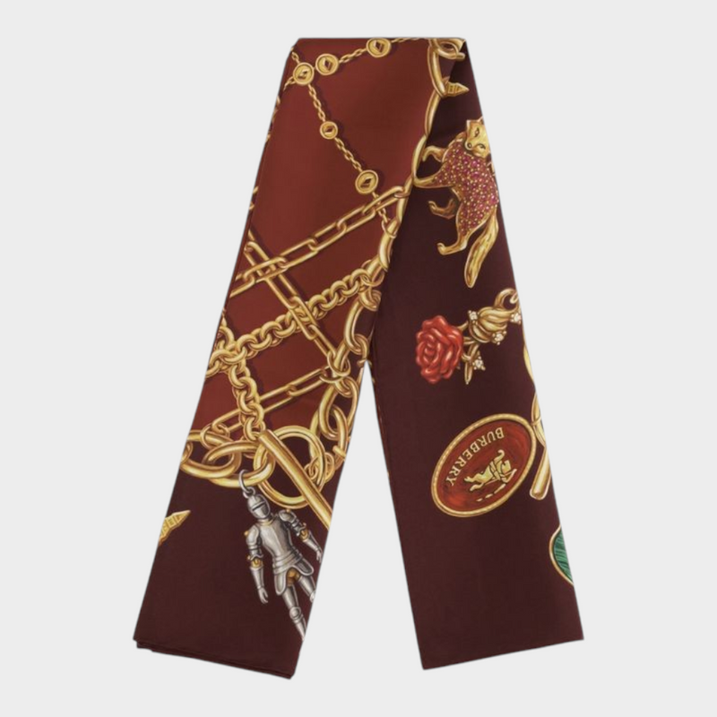 Esmire & Co Burberry bordeaux silk scarf featuring a gold charm jewellery print on a rich deep red background.
