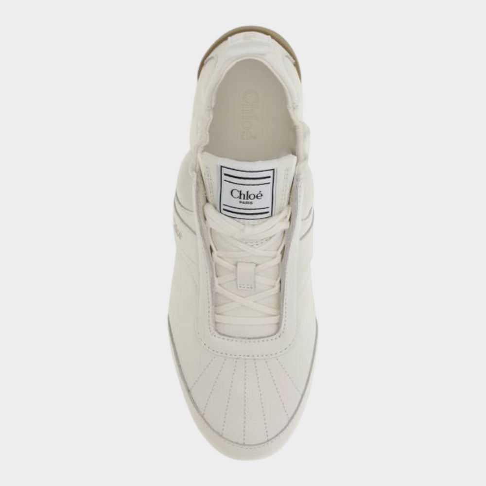 Esmire & Co Chloé beige fabric athletic sneakers with lace-up fastening and round toe, top-down view.