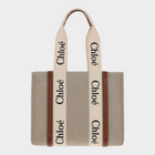 Esmire & Co Chloé Woody beige linen tote bag with iconic logo ribbon handles and brown leather trim details.