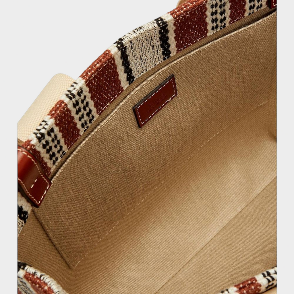 Interior of Esmire & Co Chloé brown linen tote bag featuring a cotton canvas lining, slip pocket, and leather tag.