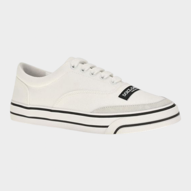 Esmire & Co Dolce&Gabbana cream canvas low top sneakers with black striped rubber sole and branded upper label