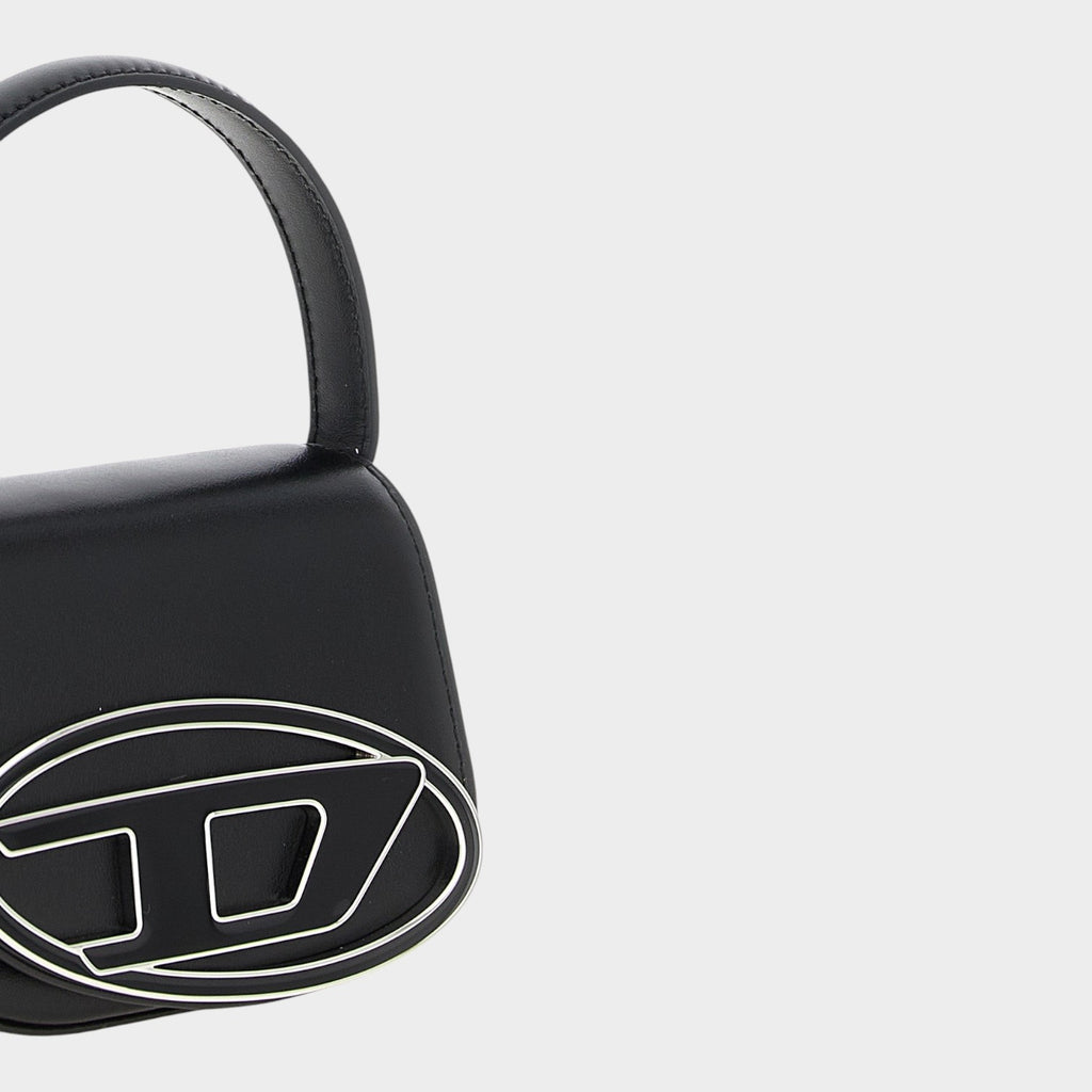 Esmire & Co Diesel 1DR XS black leather mini handbag with a prominent silver metal logo and structured top handle.