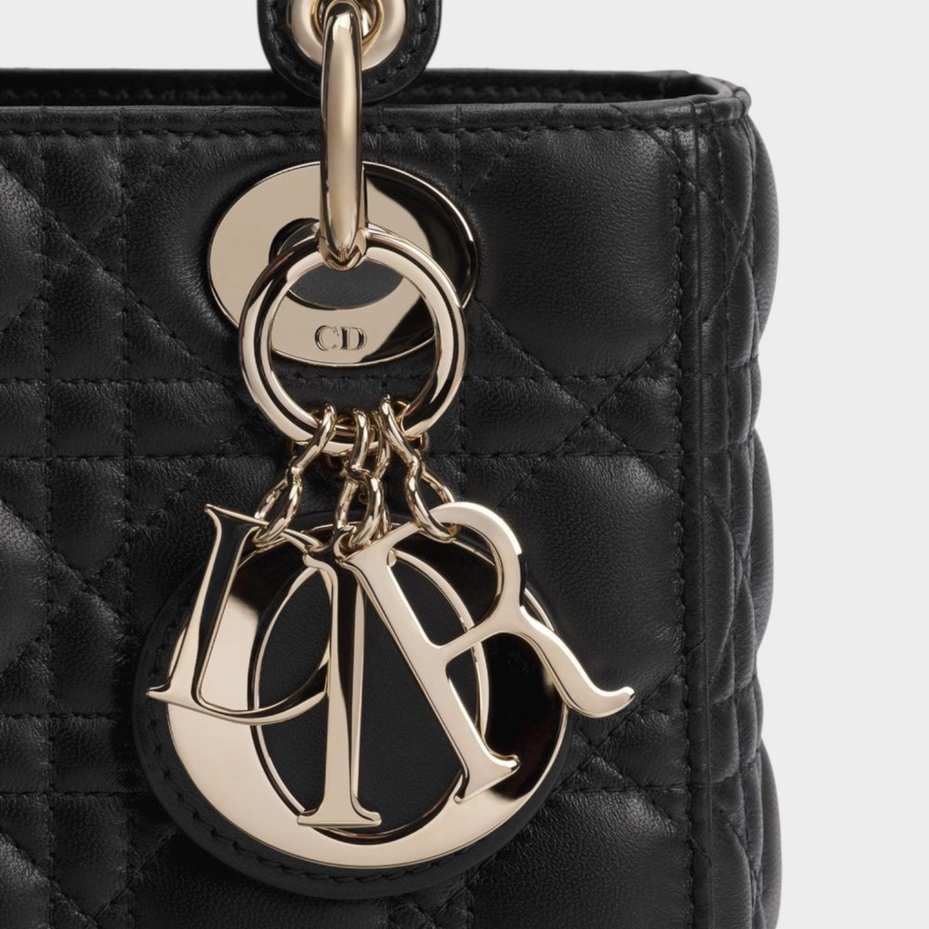 Esmire & Co Dior black quilted lamb leather handbag featuring pale gold-finish metal D.I.O.R. charms