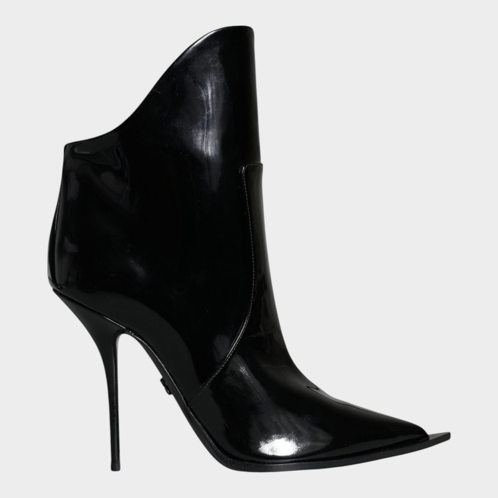 Esmire & Co Dolce & Gabbana black patent leather ankle boots with a high stiletto heel and pointed toe design.
