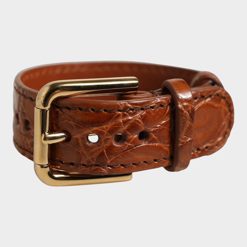 Esmire & Co Dolce & Gabbana brown caiman leather bracelet belt with a polished gold-tone buckle closure.