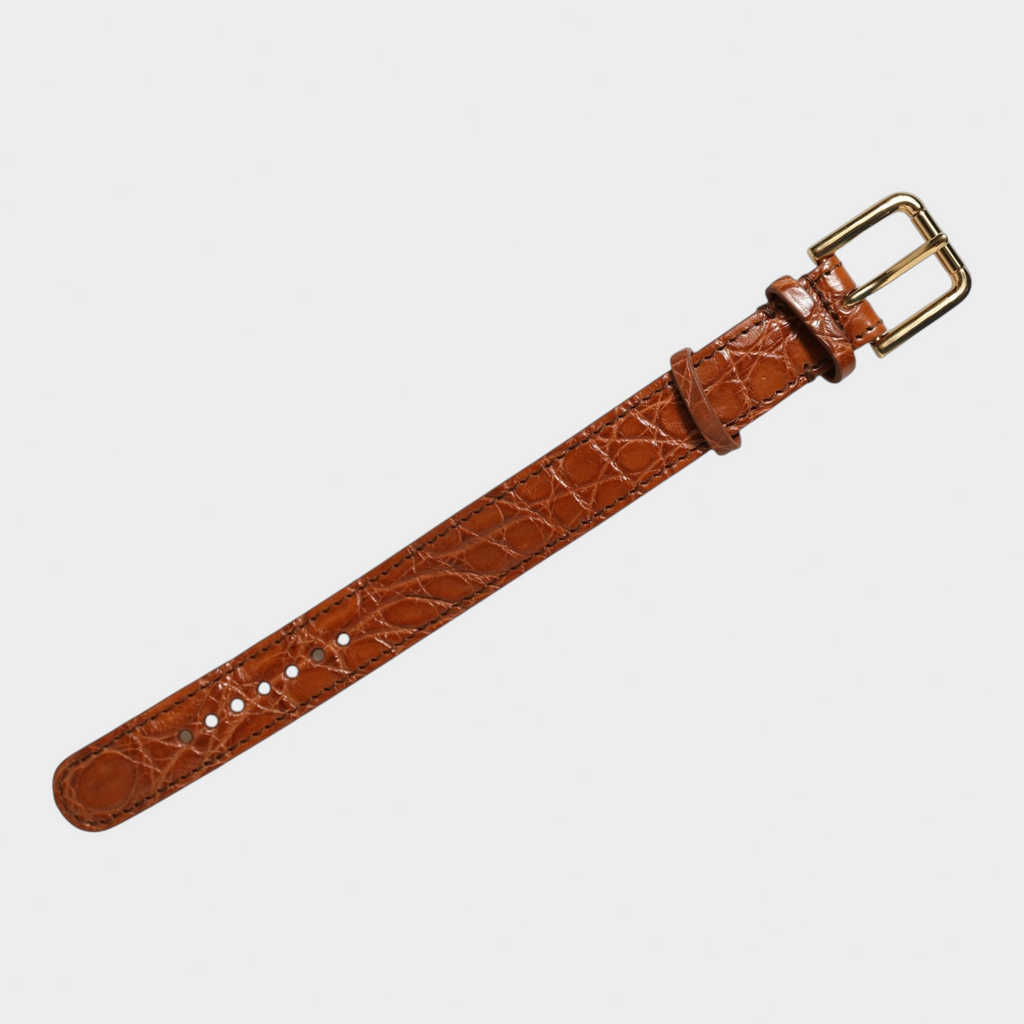 Esmire & Co Dolce & Gabbana brown caiman leather bracelet belt with a polished gold-tone buckle closure.