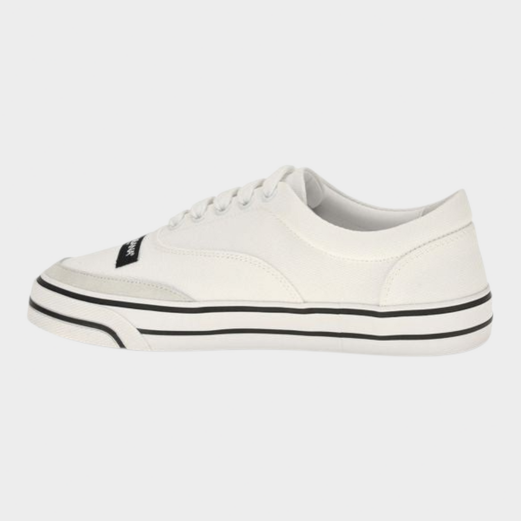 Esmire & Co Dolce&Gabbana cream canvas low top sneakers with black striped rubber sole and branded upper label