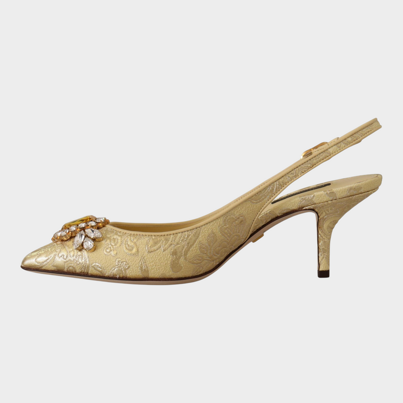 Esmire & Co Dolce & Gabbana gold slingback pumps with crystal embellishment and pointed toe design.