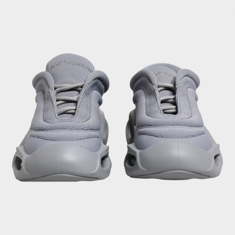 Esmire & Co Dolce & Gabbana grey slip-on sneakers with a wave-inspired design and durable rubber sole.