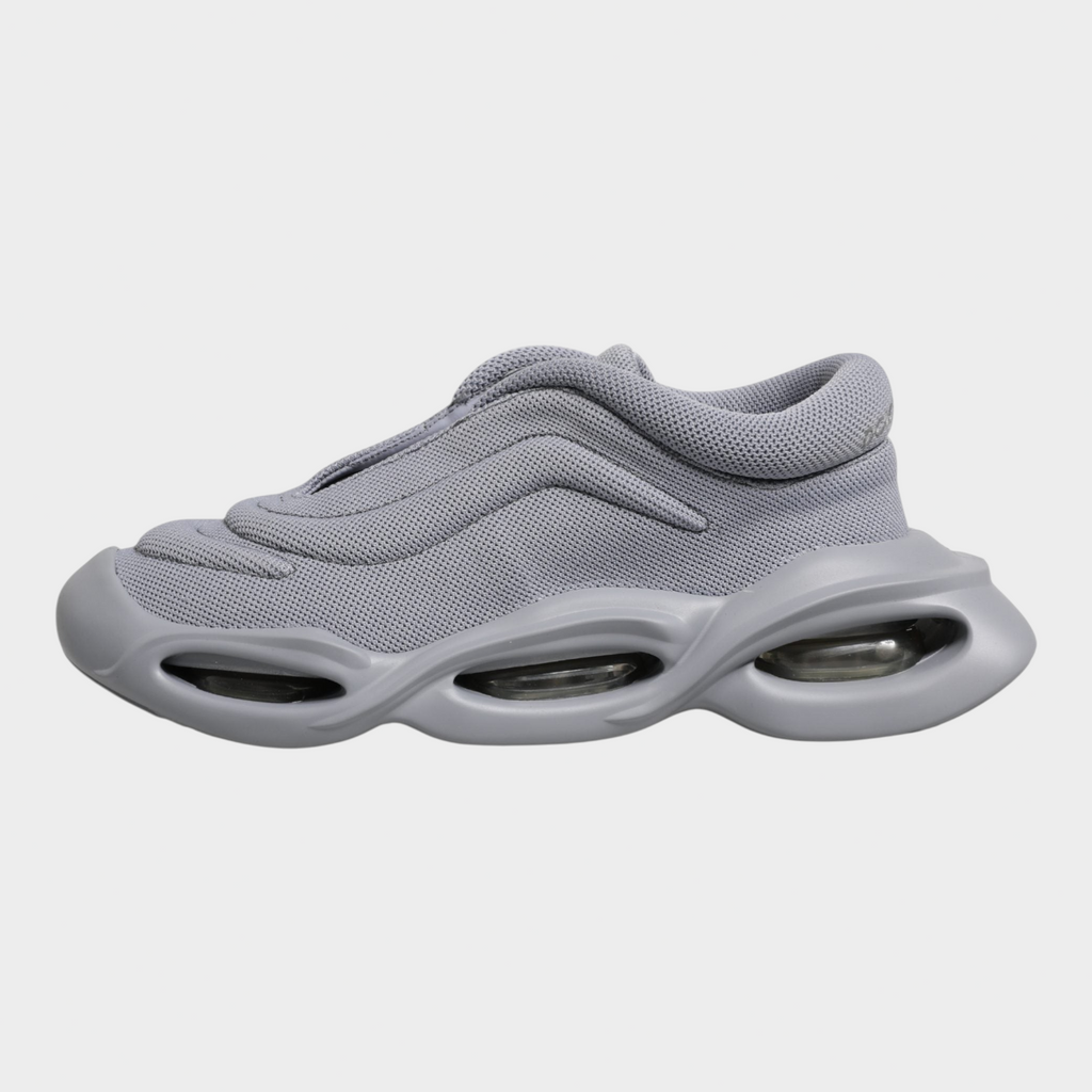 Esmire & Co Dolce & Gabbana grey slip-on sneakers with a wave-inspired design and chunky rubber sole.