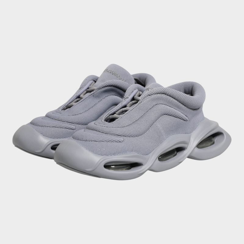 Esmire & Co Dolce & Gabbana grey slip-on sneakers with a wave-inspired design and durable rubber sole.