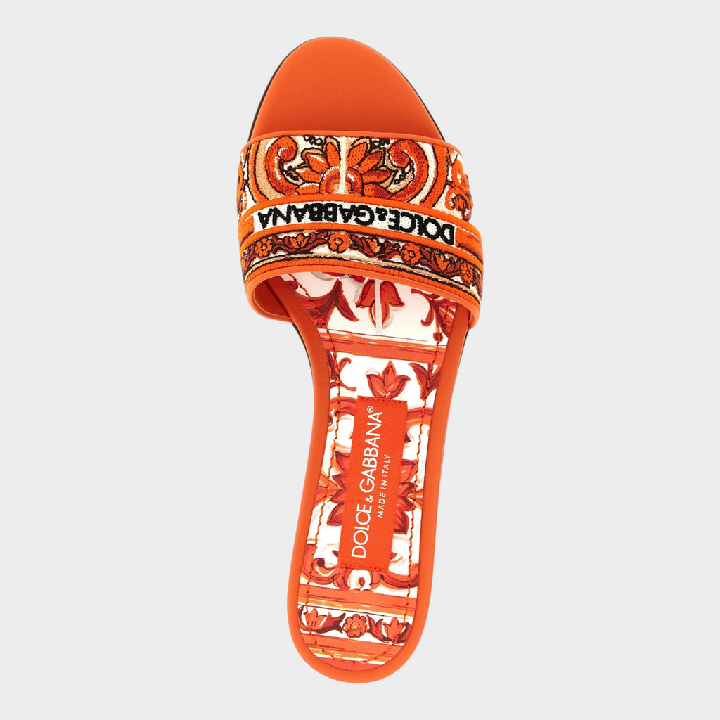 Esmire & Co Dolce & Gabbana orange cotton slides with intricate Maiolica embroidery and leather sole.