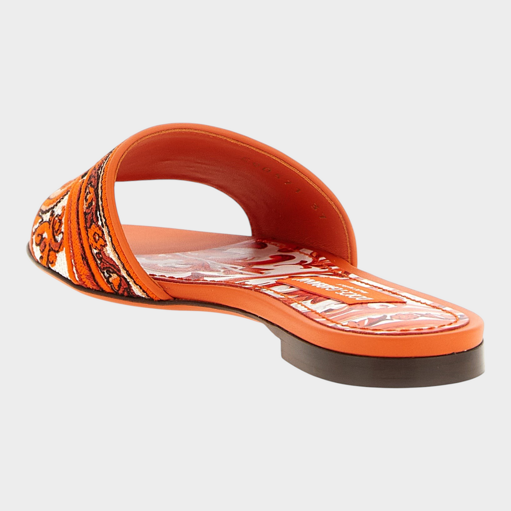 Esmire & Co Dolce & Gabbana orange cotton slides with intricate Maiolica embroidery and leather sole.