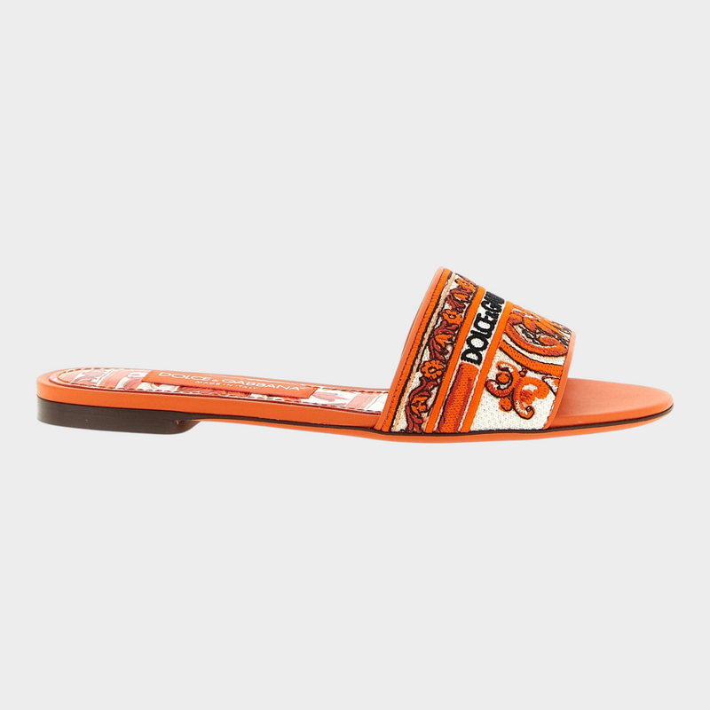 Esmire & Co Dolce & Gabbana orange cotton slides with intricate white and orange Maiolica embroidery on the band.