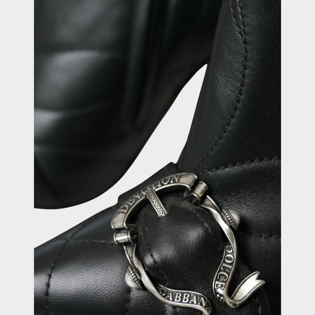Esmire & Co Dolce & Gabbana black quilted leather booties featuring a decorative silver Devotion buckle detail