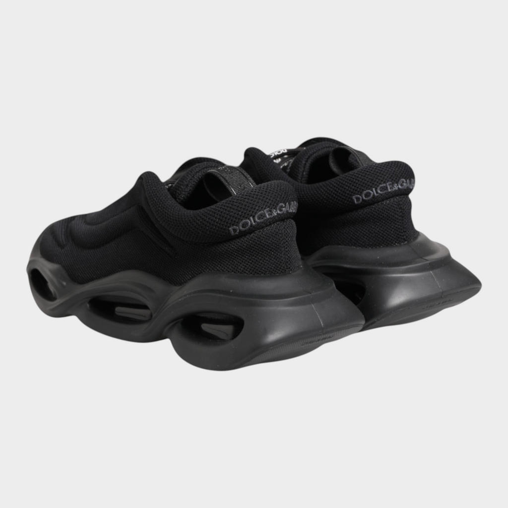 Esmire & Co Dolce & Gabbana Wave low-top sneakers in black with a sculptural wave-inspired sole and logo detailing.