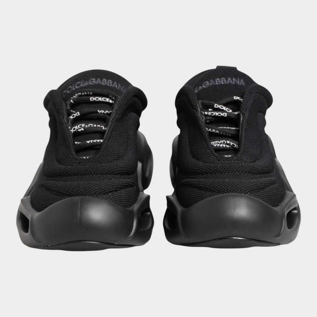 Esmire & Co Dolce & Gabbana Wave low-top sneakers in black with a sculptural sole and logo-detailed laces.