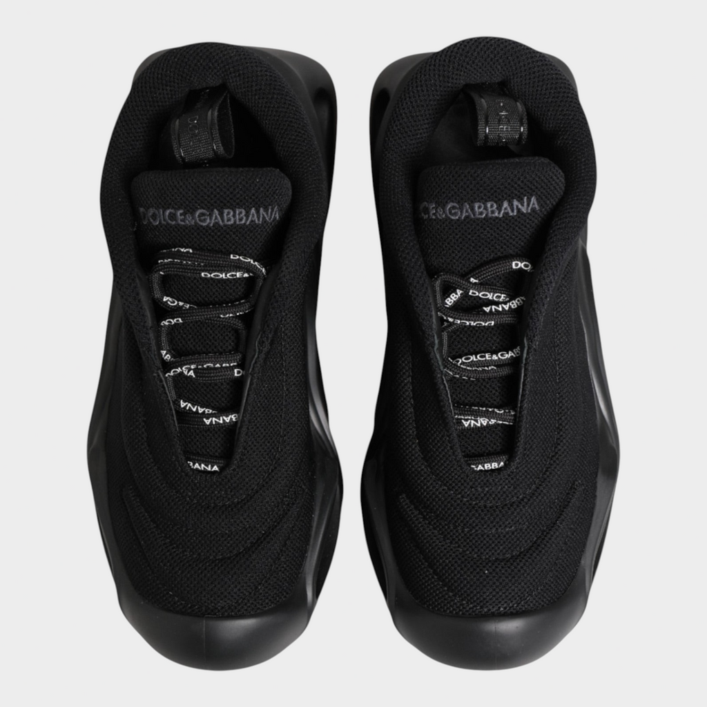 Esmire & Co Dolce & Gabbana Wave black low-top sneakers with a sculptural sole and branded lace-up closure.