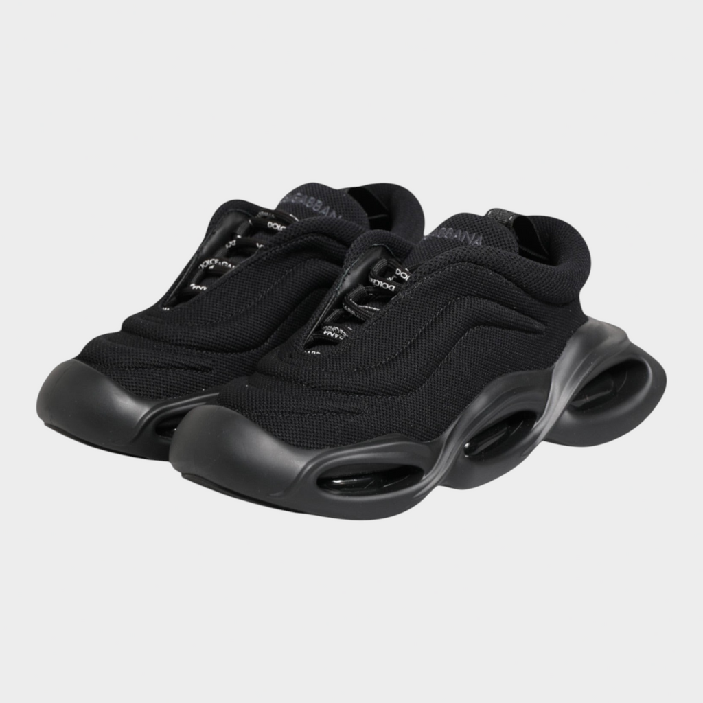 Esmire & Co Dolce & Gabbana Wave low-top sneakers in black with a sculptural wave-inspired sole and lace-up closure.
