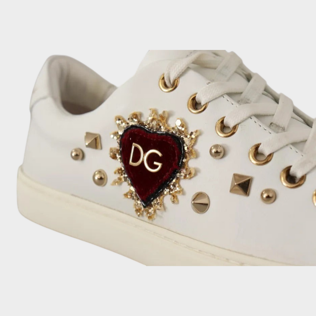 Esmire & Co Dolce & Gabbana white leather sneakers featuring a red velvet heart with gold studs and DG logo detail.