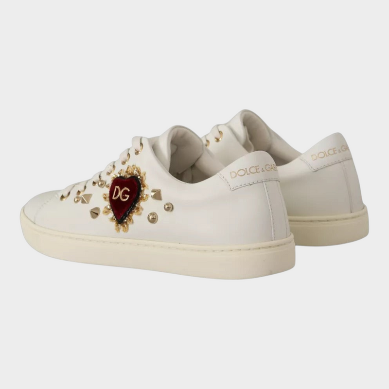 Esmire & Co Dolce & Gabbana white leather sneakers featuring a red velvet heart, gold studs, and logo detailing.