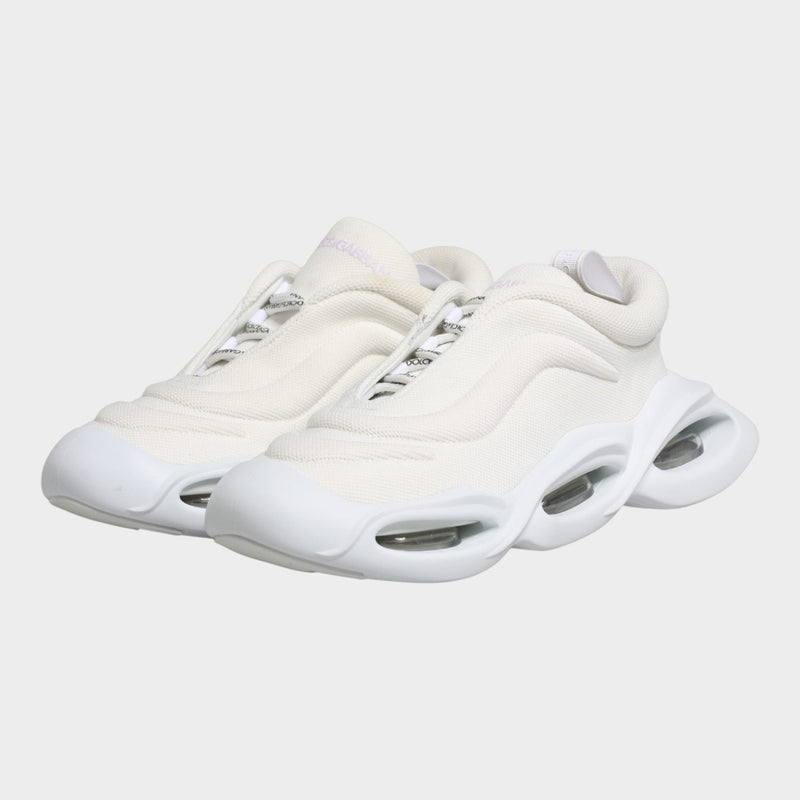 Esmire & Co Dolce & Gabbana white slip-on low top sneakers with a unique wave-inspired rubber sole design.