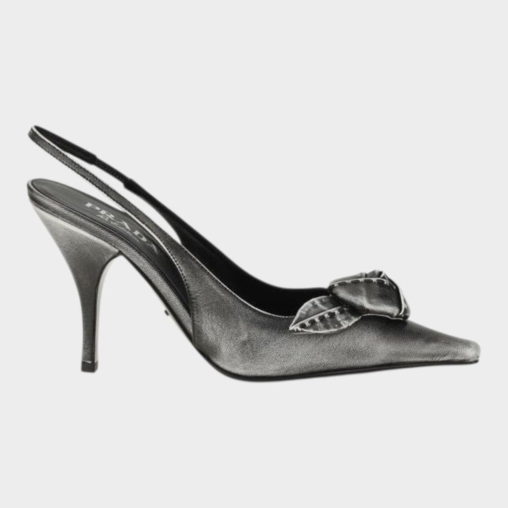 Esmire & Co gray goatskin slingback pumps with pointed toe, floral appliqué, and 90mm heel in a distressed finish.