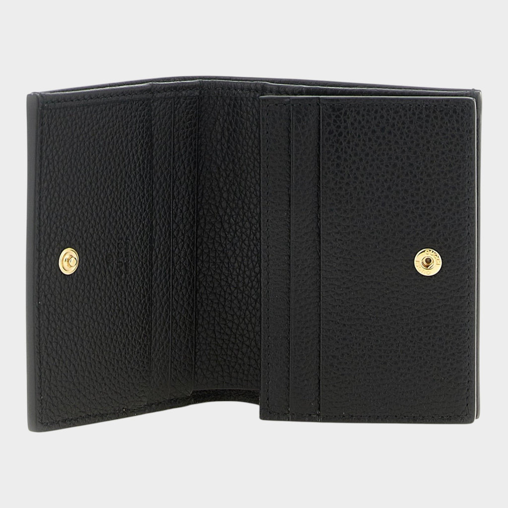 Esmire & Co Gucci black calfskin leather cardholder with gold snap buttons and multiple interior card slots