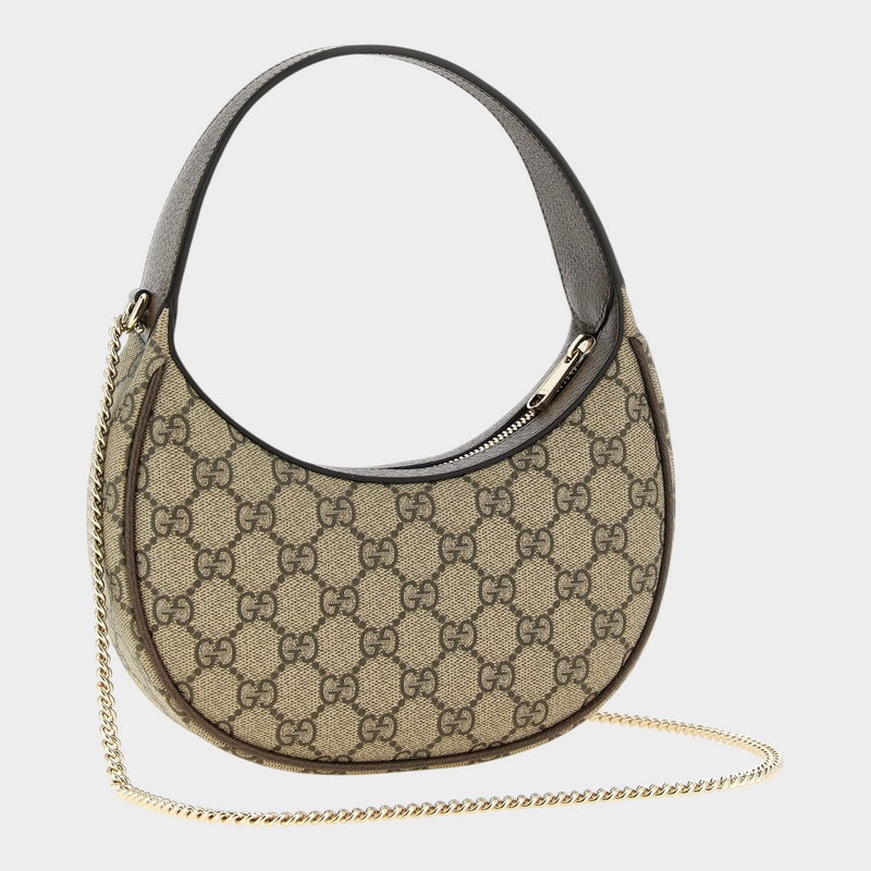 Esmire & Co Gucci Ophidia crescent shoulder bag in beige GG Supreme canvas with brown leather trim and gold chain.
