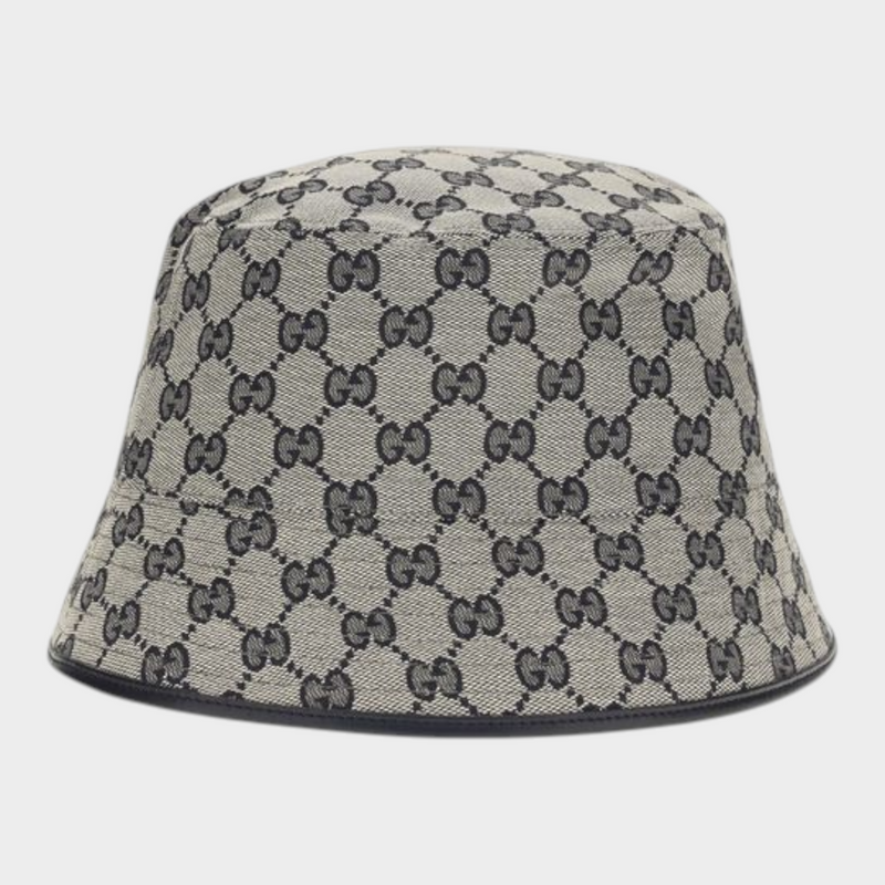 Esmire & Co Gucci gray bucket hat in GG monogram canvas with black leather trim and a classic wide brim silhouette.