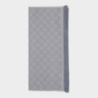 Esmire & Co gray wool Gucci scarf featuring an all-over GG logo embroidery and elegant frayed edge detailing.
