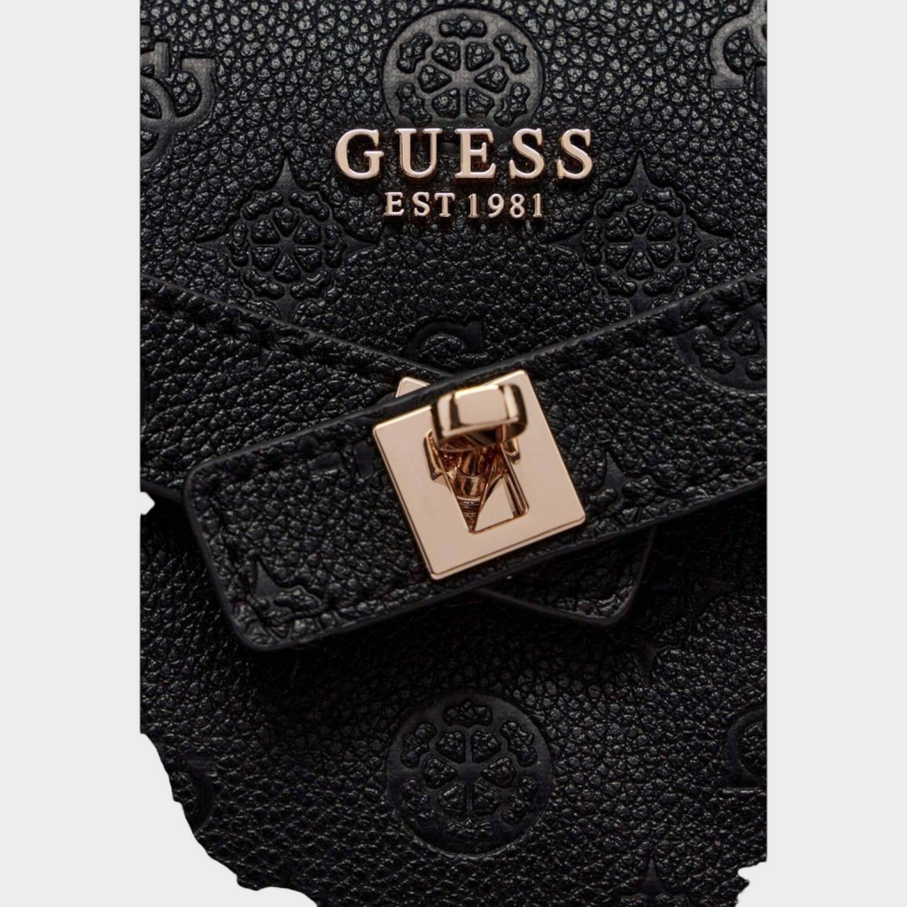 Esmire & Co black Guess handbag featuring embossed logo pattern and gold-tone metallic clasp detail
