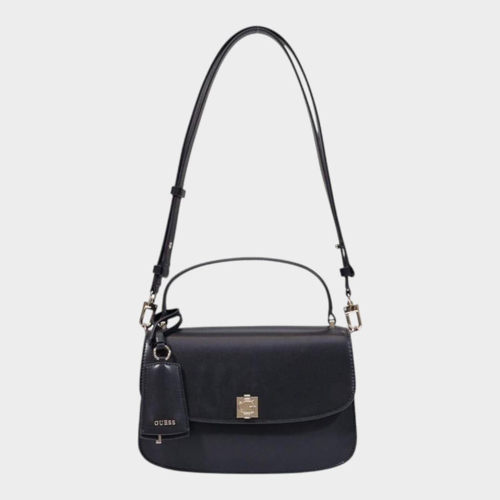 Esmire & Co Guess black polyurethane handbag with gold clasp, top handle, and adjustable shoulder strap.